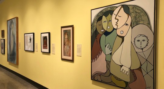 Installation showing framed works of various sizes