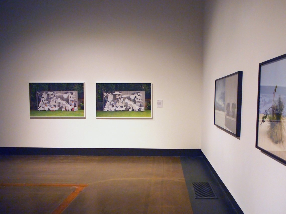 installation shot of four pictures hanging on white gallery walls
