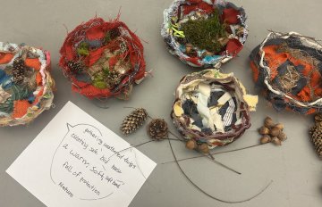 Photo taken form above - hand-made birds nests made of recyclable materials