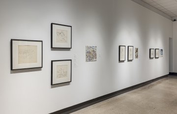 Side view of the white wall with conte sketches