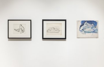 White background with three artworks, two conte drawings and an arctic landscape painting
