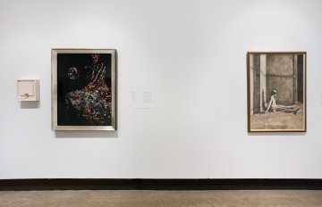 Installation shto of three artworks mounted closely on a white wall